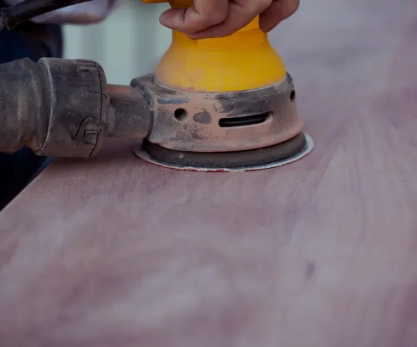 FDM 3D printed part surface being sanded for smooth finish and post-processing preparation