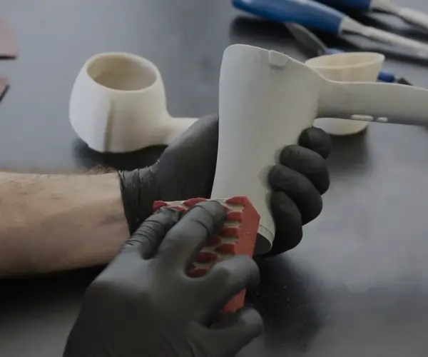 Manual sanding of 3D printed part to smooth surface and remove print layer lines