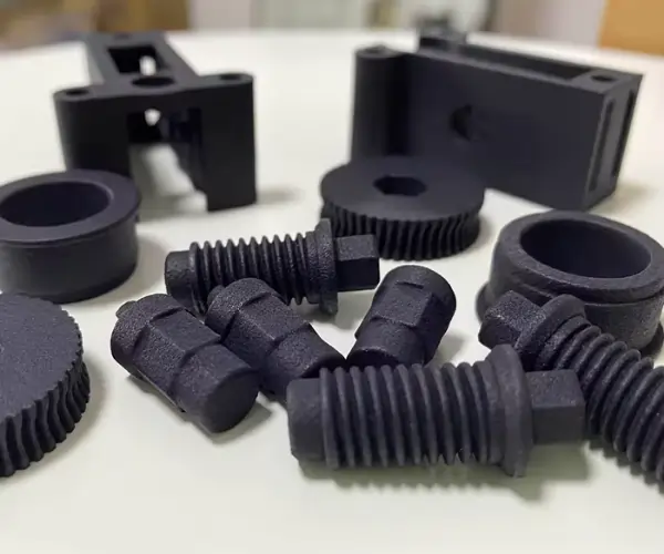 Black-dyed MJF printed parts showcasing uniform color and enhanced surface aesthetics.